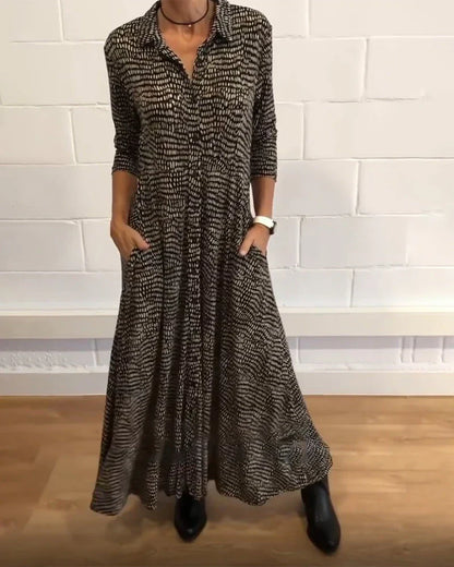 elegantes langes trapezkleid mit taschen und knopfdetails