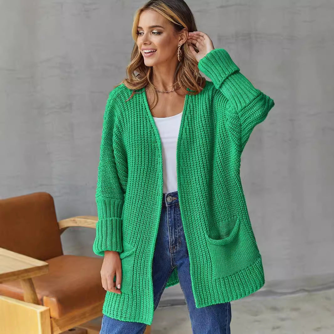 Damen Grobstrickjacke mit tiefem V-Ausschnitt und praktischen Taschen Merchesia