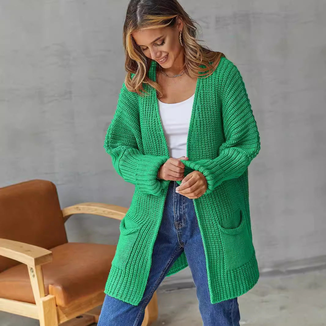 Damen Grobstrickjacke mit tiefem V-Ausschnitt und praktischen Taschen Merchesia