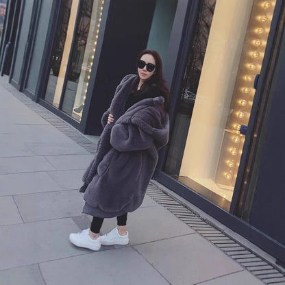 Damen Übergroßer Kunstfellmantel mit Kapuze und Taschen Merchesia