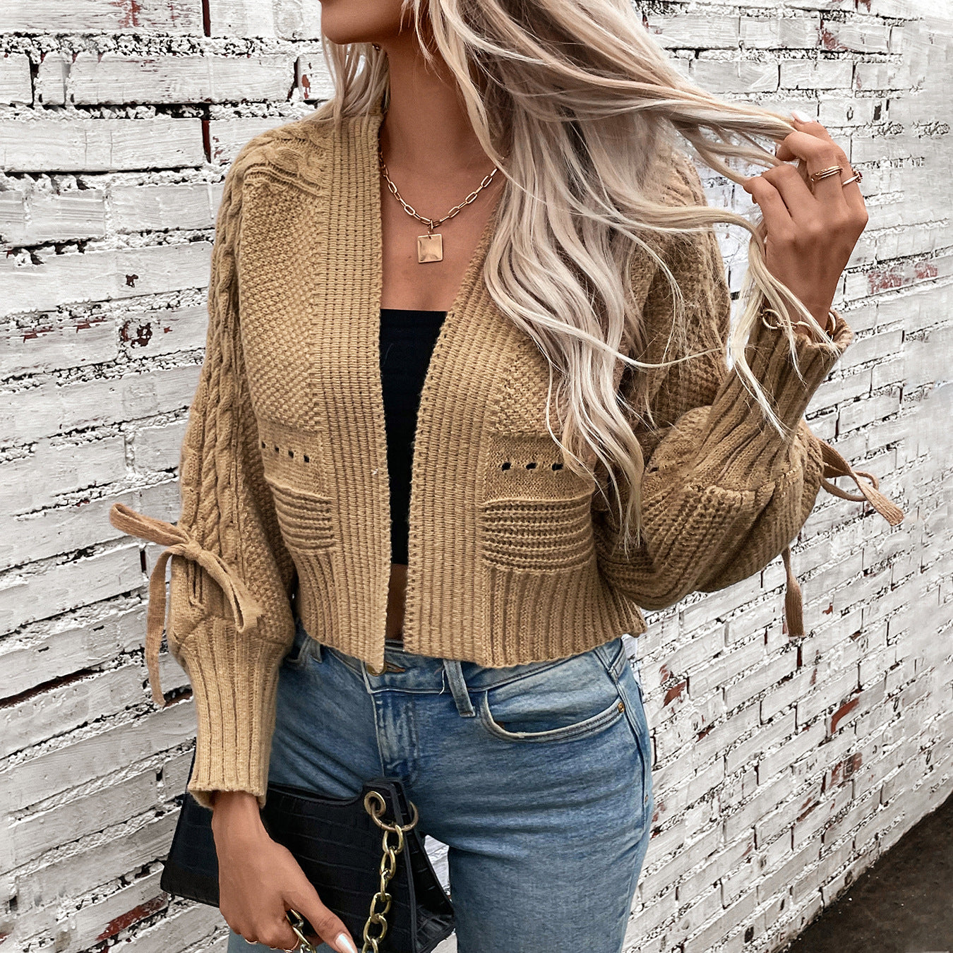 Damen modische Strickjacke mit voluminösen Ärmeln und Zopfmuster Merchesia